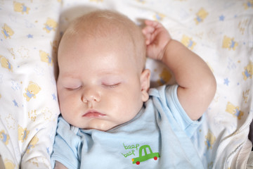 Newly bathed newborn baby sleeps