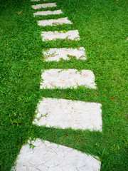 stone walkway on grass