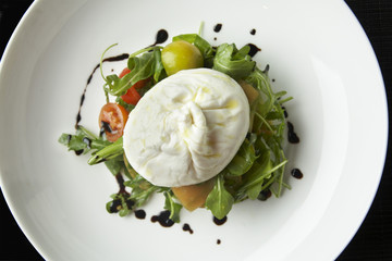 Buratta salad with arugula and cherry tomatoes