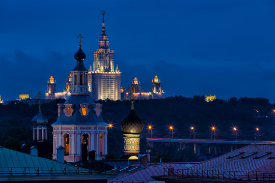 View to the observation deck of the Russian Academy of Sciences at the University of Moscow and St. Andrew's Monastery at night, Russia