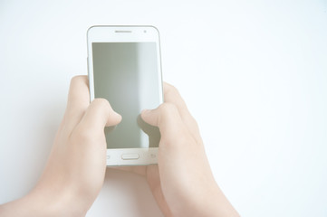 Girl holding a white smartphone. White background