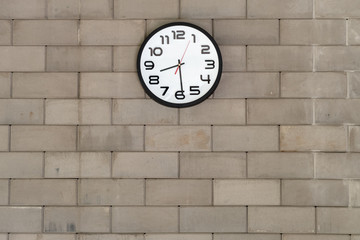 Fototapeta na wymiar Clock analog brick wall background.