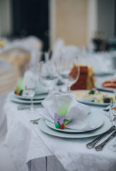 stylish luxury decorated table with flowers and delicious food, celebration wedding, catering in the restaurant