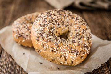 Wooden table with fresh baked wholemeal Bagels