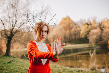 tale. fantastic redhead girl in a mysterious forest