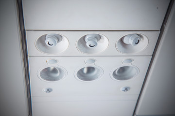 Close up of Light and air conditioner switch control panel on the airplane, Overhead console in airplane