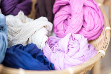 close-up of colorful dyeing in wooden basket