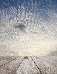 Wooden table top on blurred sky