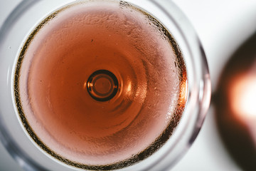 Red wine close up on a wineglass on a zenital point of view