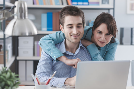 Young couple surfing the web at home