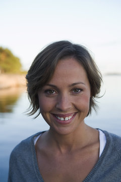 A woman by the sea in the archipelago of Stockholm, Sweden.