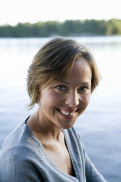 A woman by the sea in the archipelago of Stockholm, Sweden.