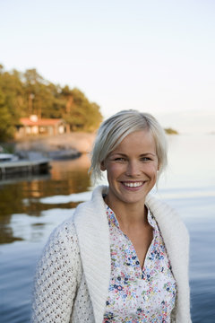 A woman by the sea in the archipelago of Stockholm, Sweden.