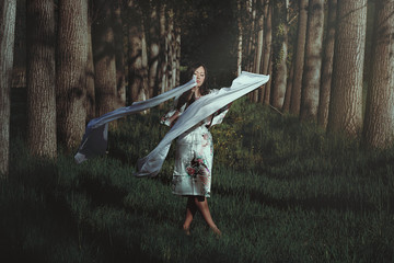 Beautiful woman dancing in ethereal forest - obrazy, fototapety, plakaty