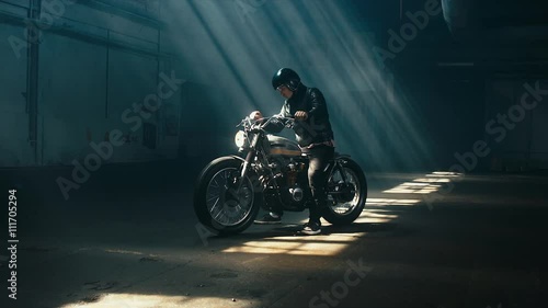 Young Caucasian Male Biker In Leather Jacket Driving His Custom