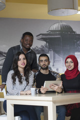 Group of mixed-race students are hanging out at the canteen