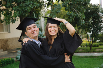 Graduates happily embracing