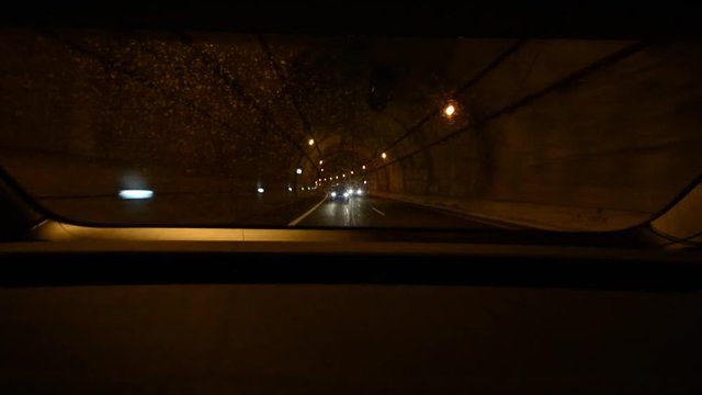 Car driving fast in tunnel. Chase.