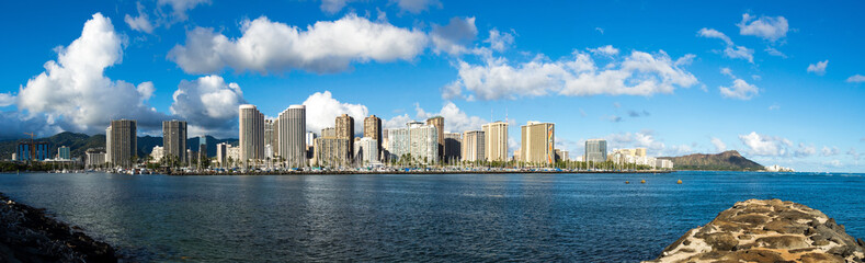 Fototapeta na wymiar Panoramic image of the Ala Wai Boat Harbor and hotels of Waikiki