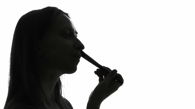 Woman applying makeup