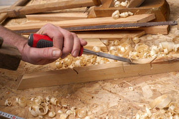 carpenter working,hammer,meter and screw-driver on construction background