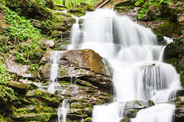 Obraz premium small waterfall of mountain river