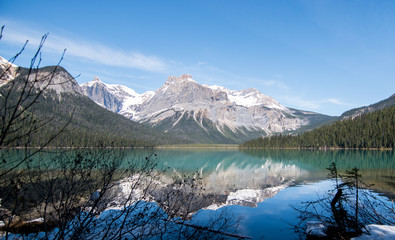 Canda, Rocky Mountains, Yoho Natational Park: view on the Emerald Lake and an exact water reflection of the Mountain visible in the Lake