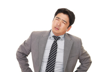 疲れた表情のビジネスマン