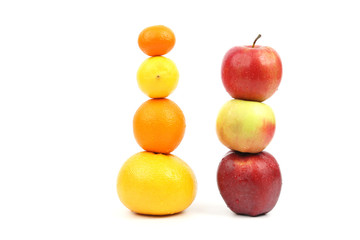 apples and citrus stand vertically on each other 
