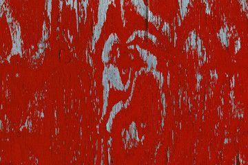 Closeup view of wood with red peeling paint