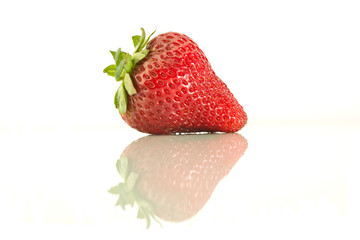 One strawberry on a white background