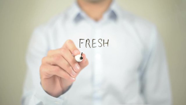 Fresh Ideas , Man writing on transparent screen