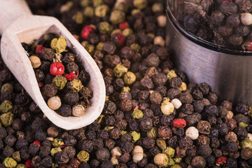 Colored pepper on a wooden background.