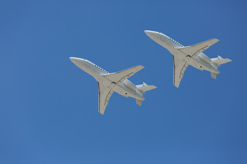 Two private jets flying close to each other