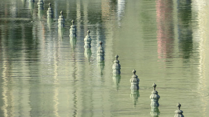 Reflections of the ancient fountain complex in the water