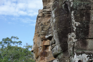 Stone face in Bayon Temple at Angkor Wat complex in Siem Reap Cambodia