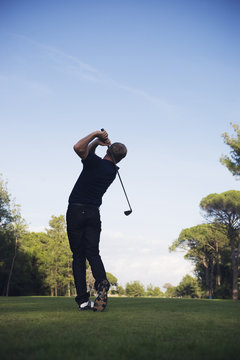 Man playing golf on golf course