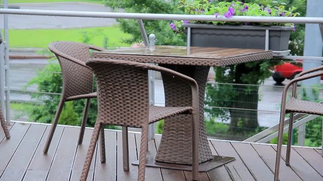 Raindrops on railing of an outdoor cafe