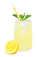 Glass of summer lemonade with mint and straw isolated on a white background