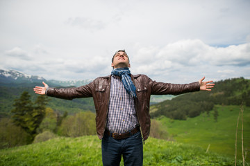 Man enjoy with freedom feel on the top of mountain