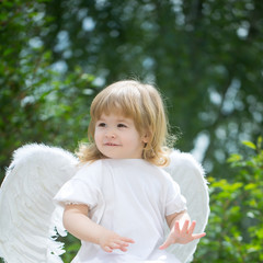 Little boy dressed as angel