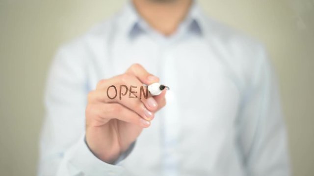 Open Source , Man writing on transparent screen
