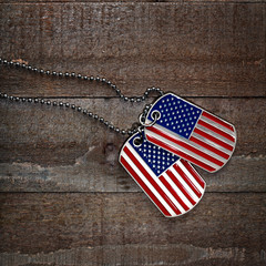 USA dog tags on wooden background