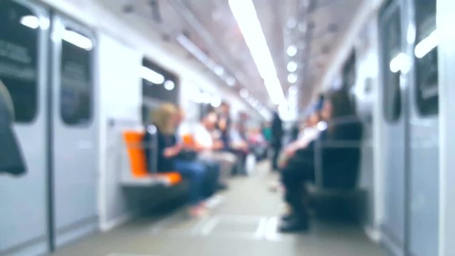 Blurred background People in the metro train in motion