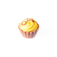 Yellow  cupcake on white background. Chocolate Cake