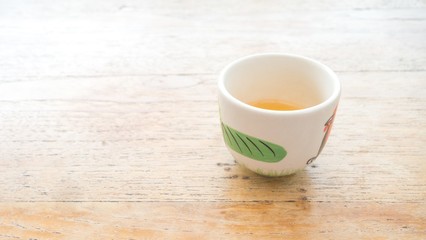 a cup of tea with wood background : copy space