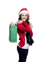 portrait of a young woman with shopping bags smiling.