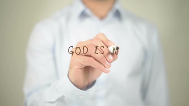 God is not Dead , Man writing on transparent screen