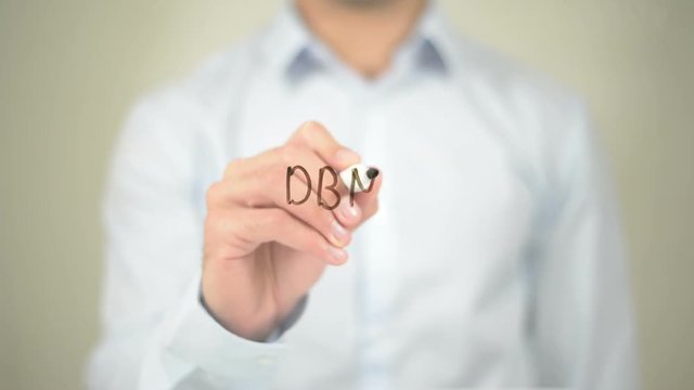 DBMS, Man writing on transparent screen