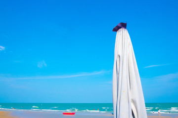 closed beach umbrella